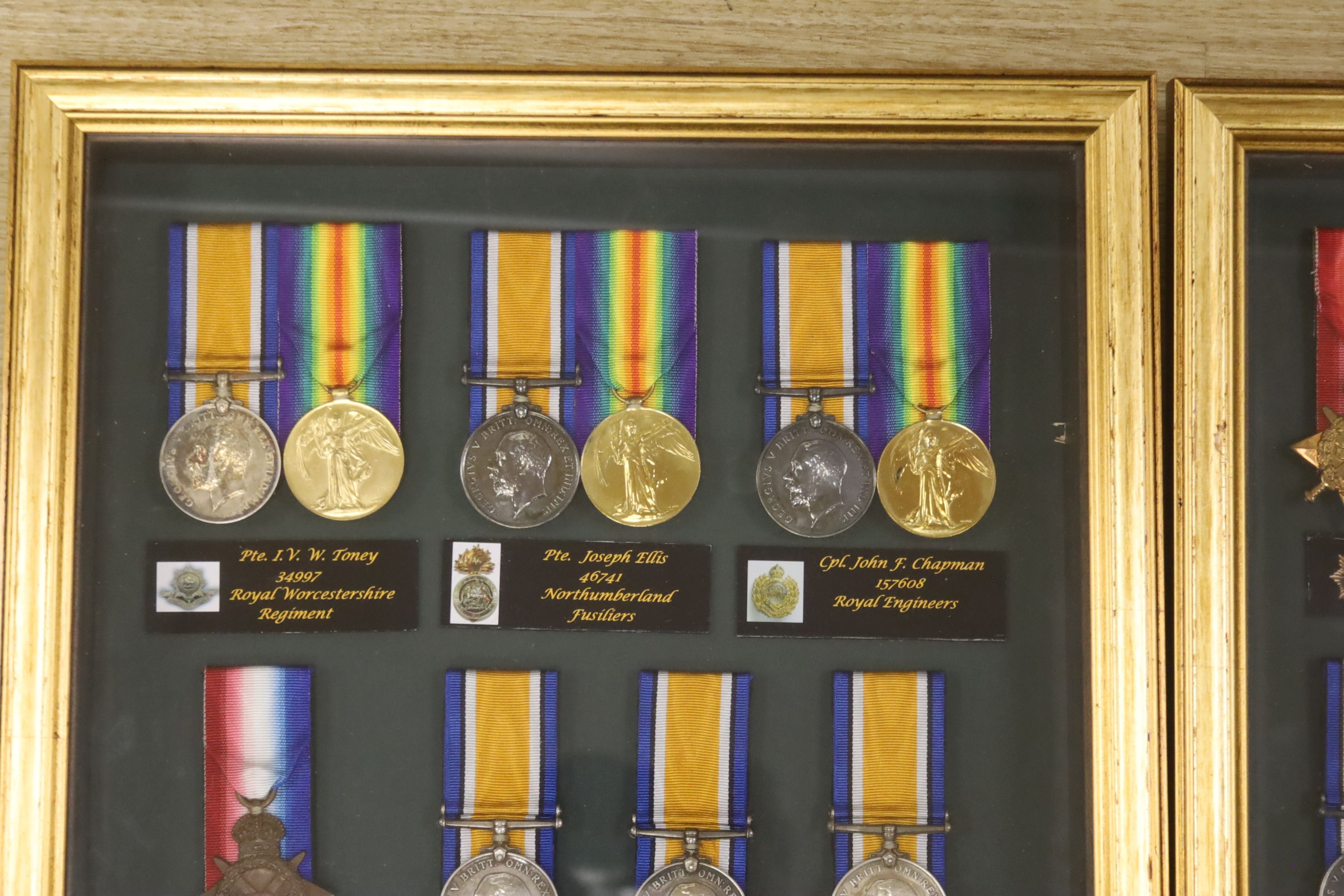 Two framed collections of WW1 medal groups